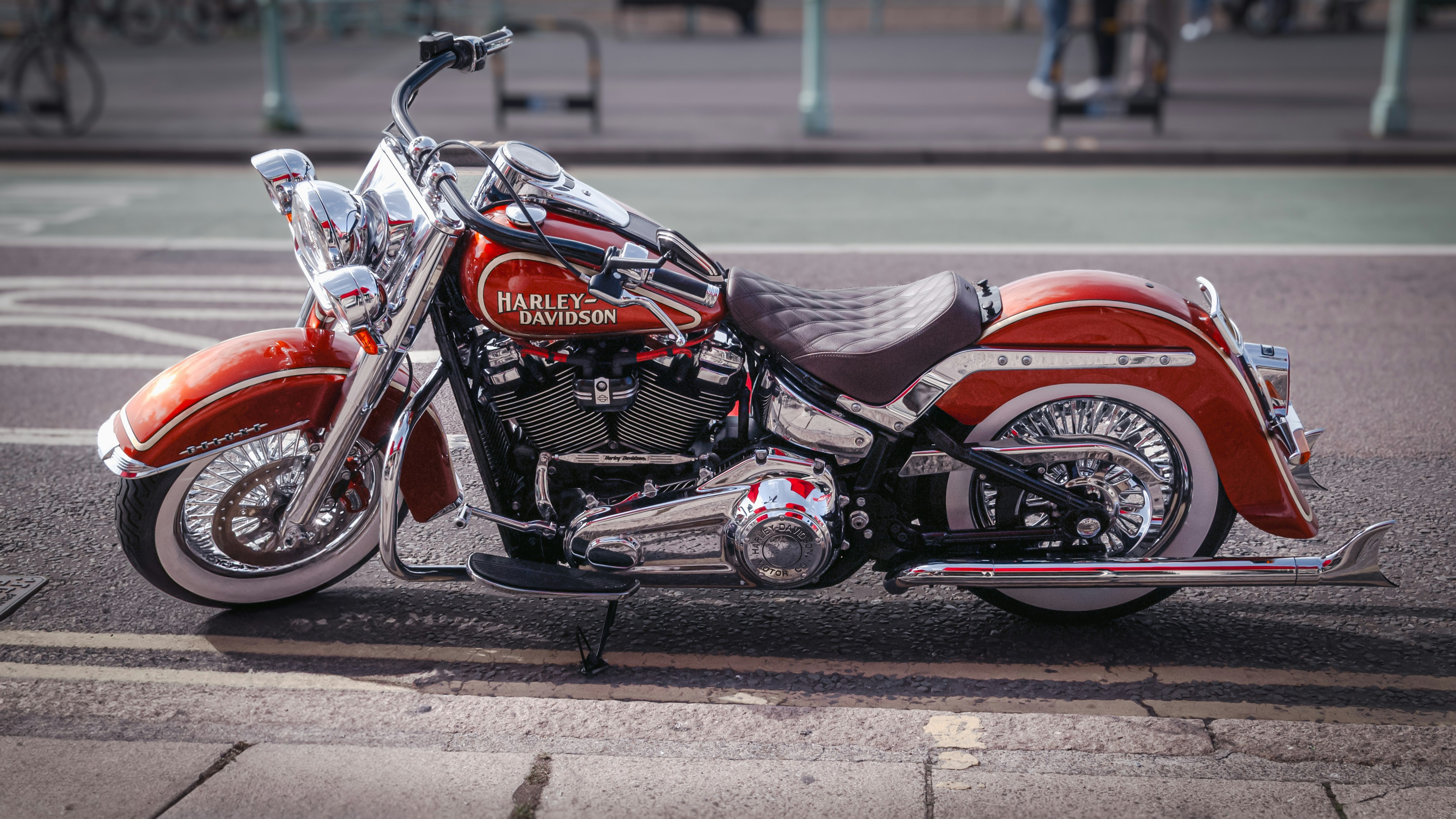 A red motorcycle parked on the side of the road