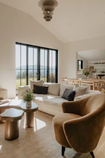 A living room filled with furniture and a large window