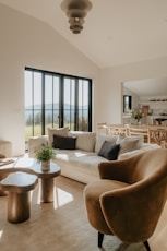 A living room filled with furniture and a large window