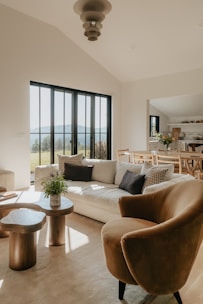 A living room filled with furniture and a large window