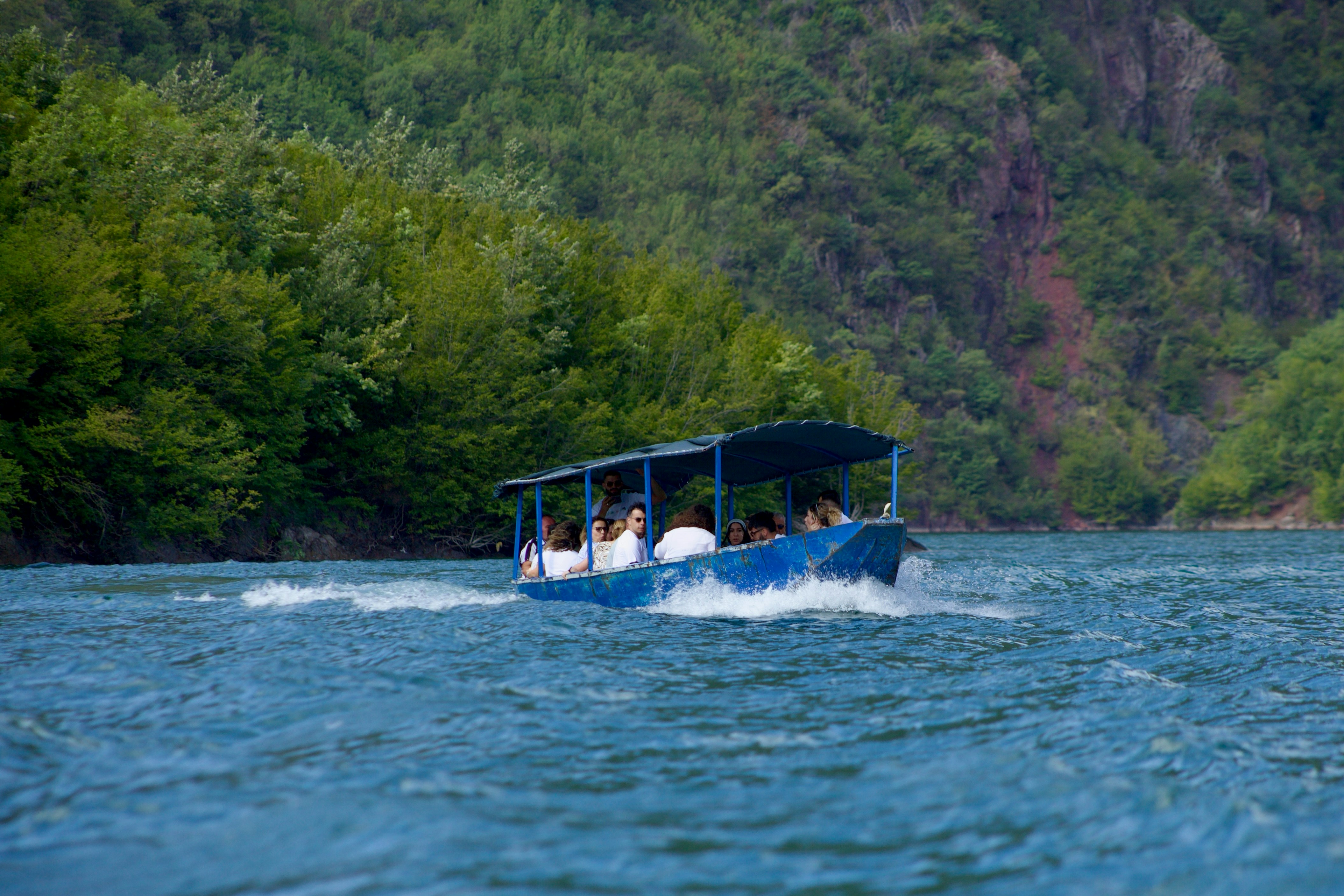 A group of people on a boat in the water