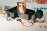 A couple of keys are sitting in a holder