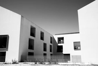 A black and white photo of two buildings
