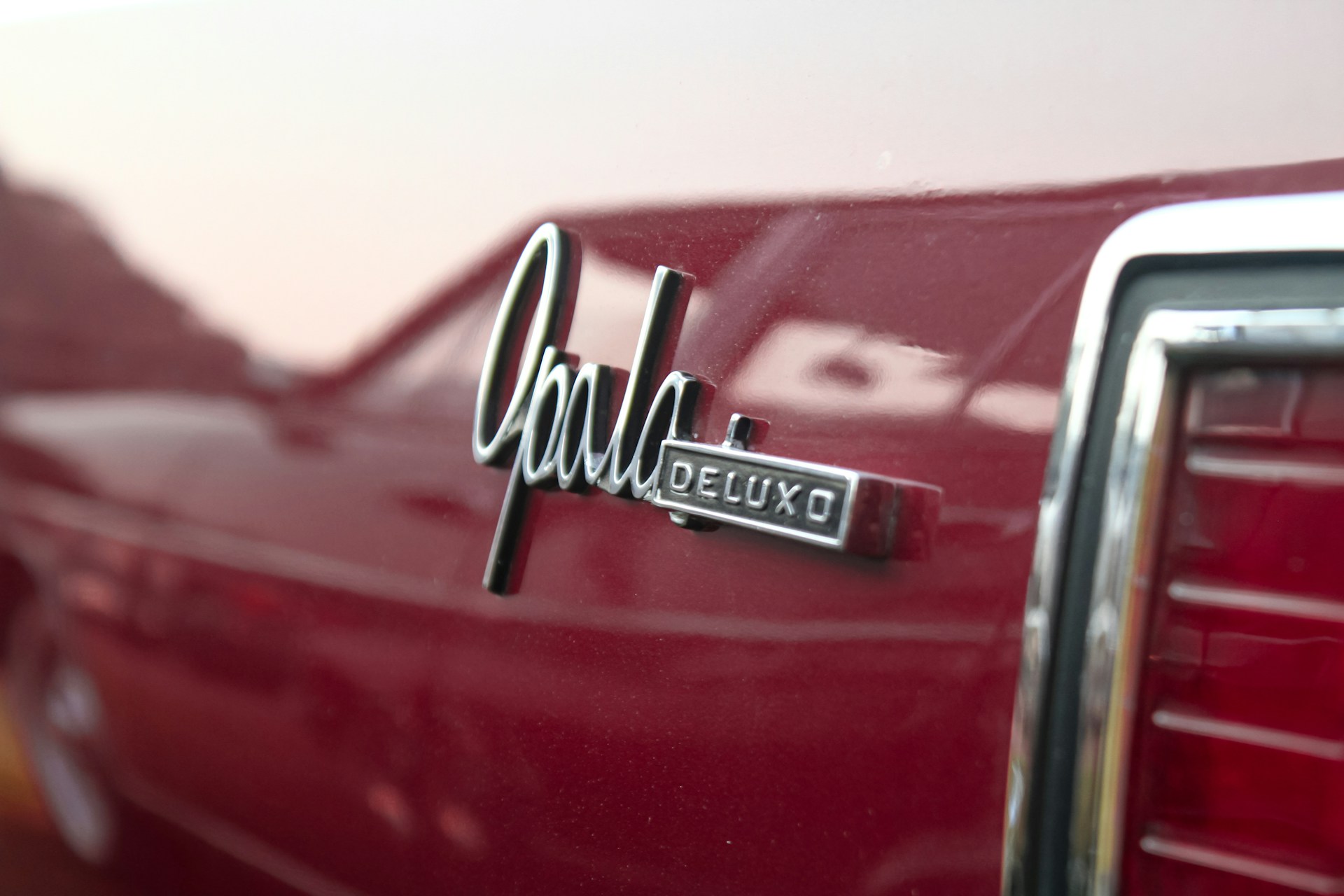 A close up of the emblem on a red car