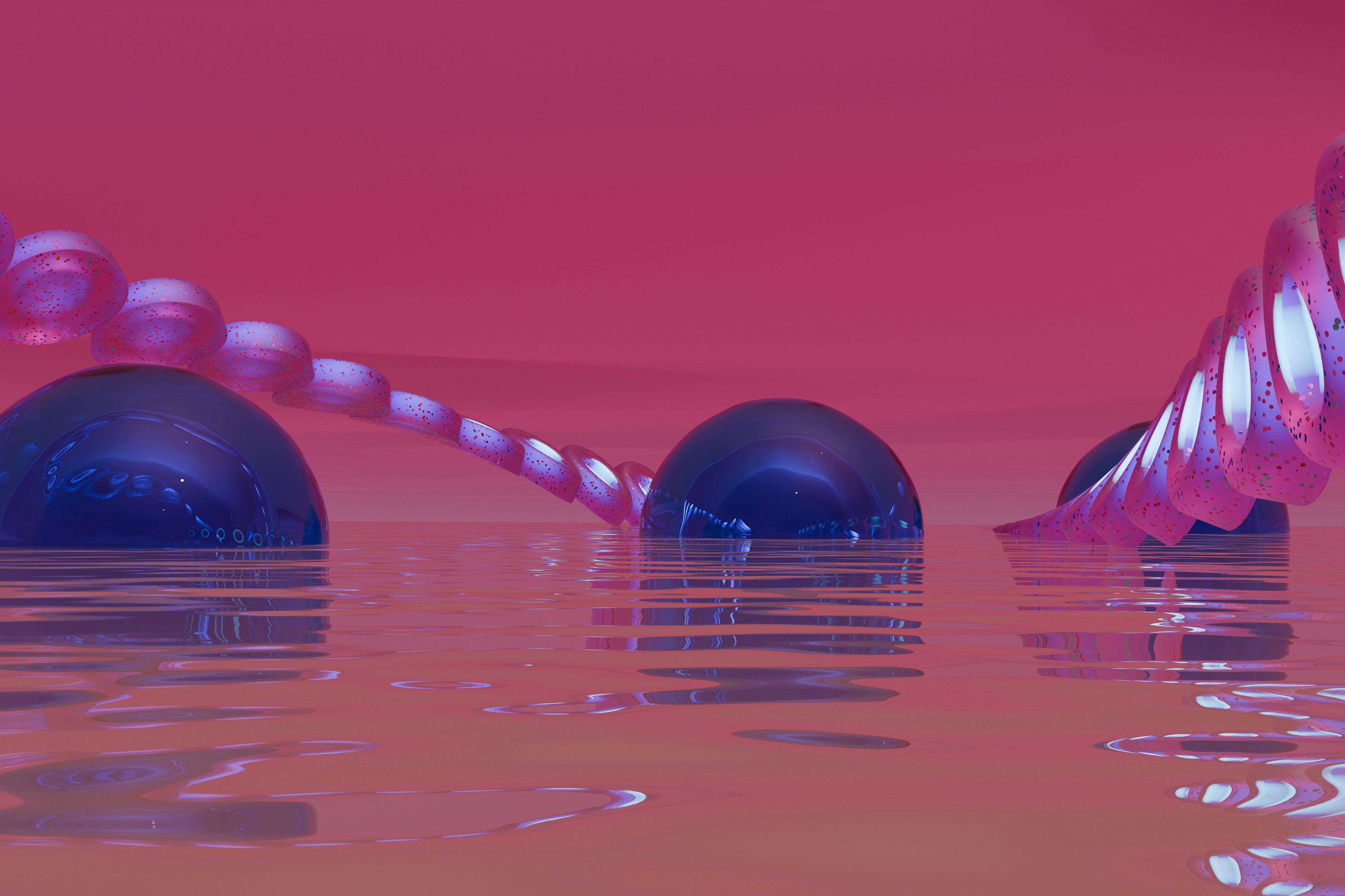 A group of balls floating on top of a body of water photo – Free Art ...