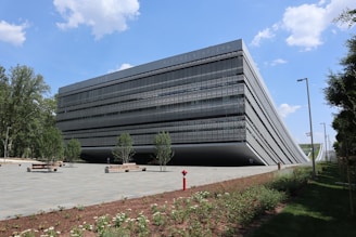 A large black building sitting on the side of a road