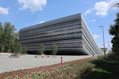 A large black building sitting on the side of a road