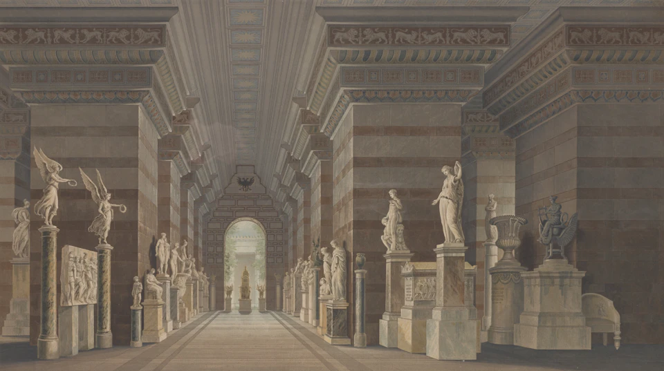 Grand room with high ceilings and large columns supporting intricate designs and statues