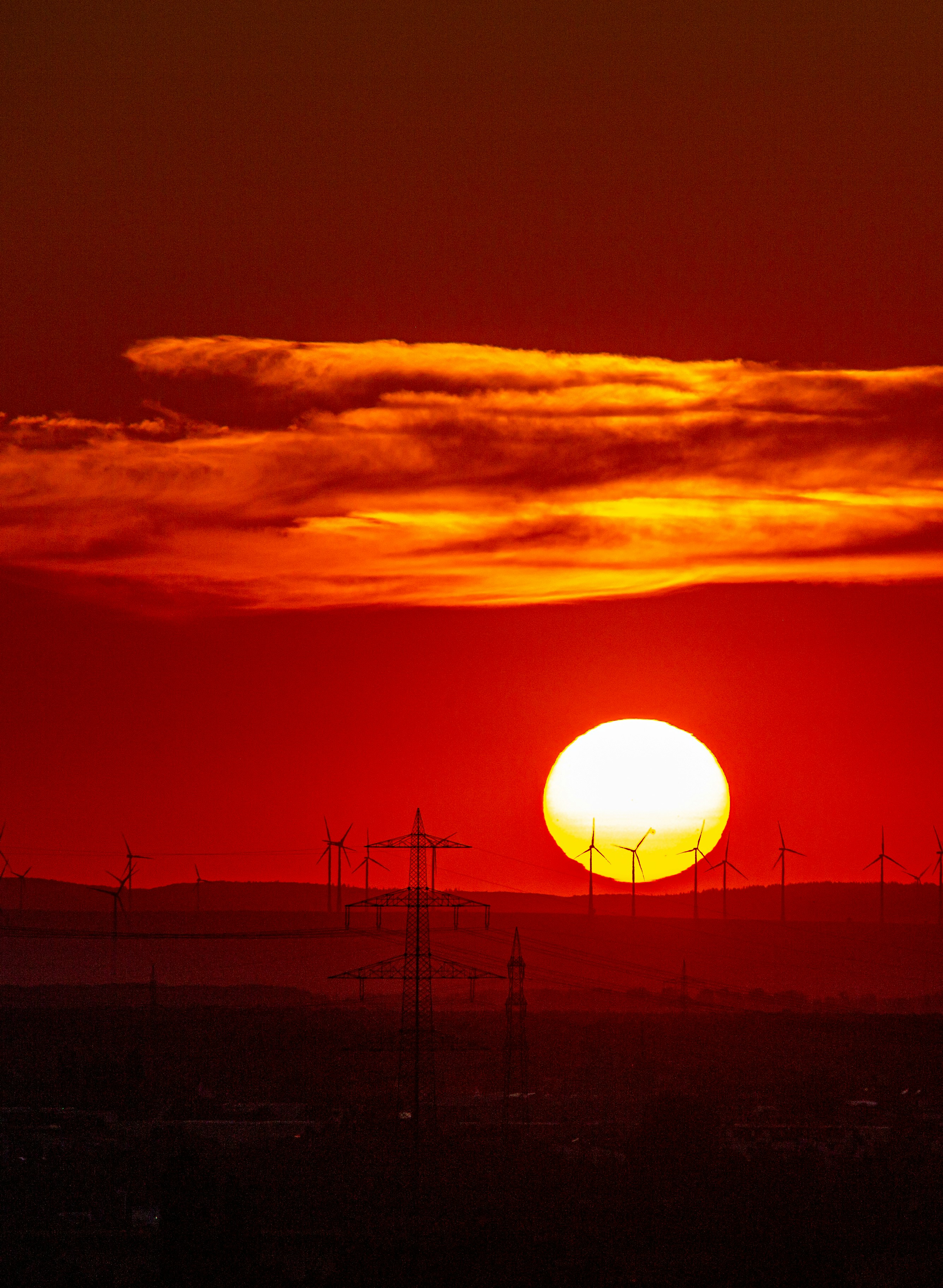 The sun is setting over the horizon of a city
