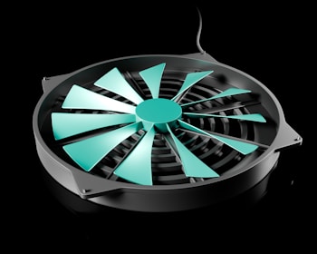 A black and green fan on a black background