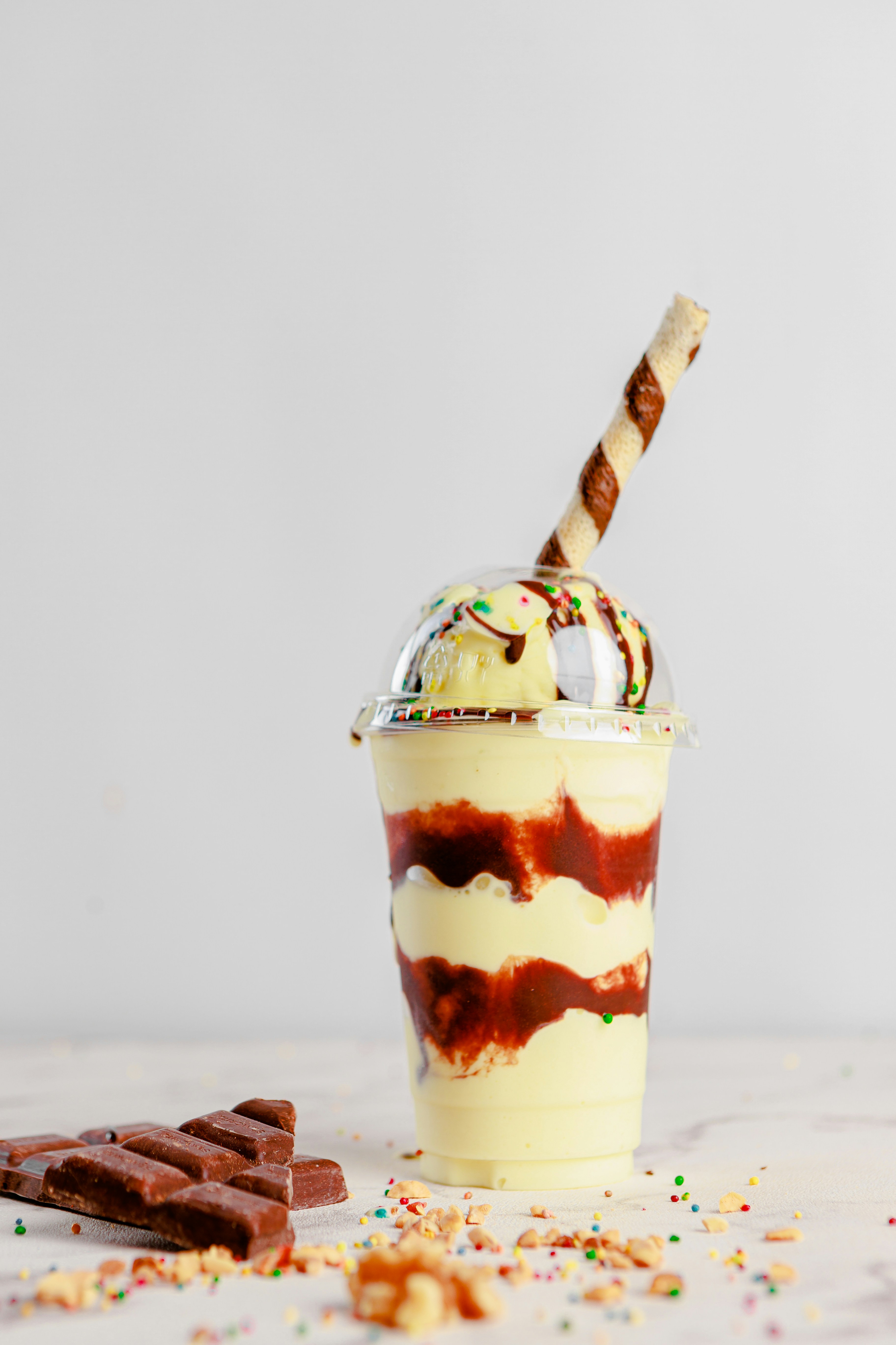 An ice cream sundae with chocolate and sprinkles