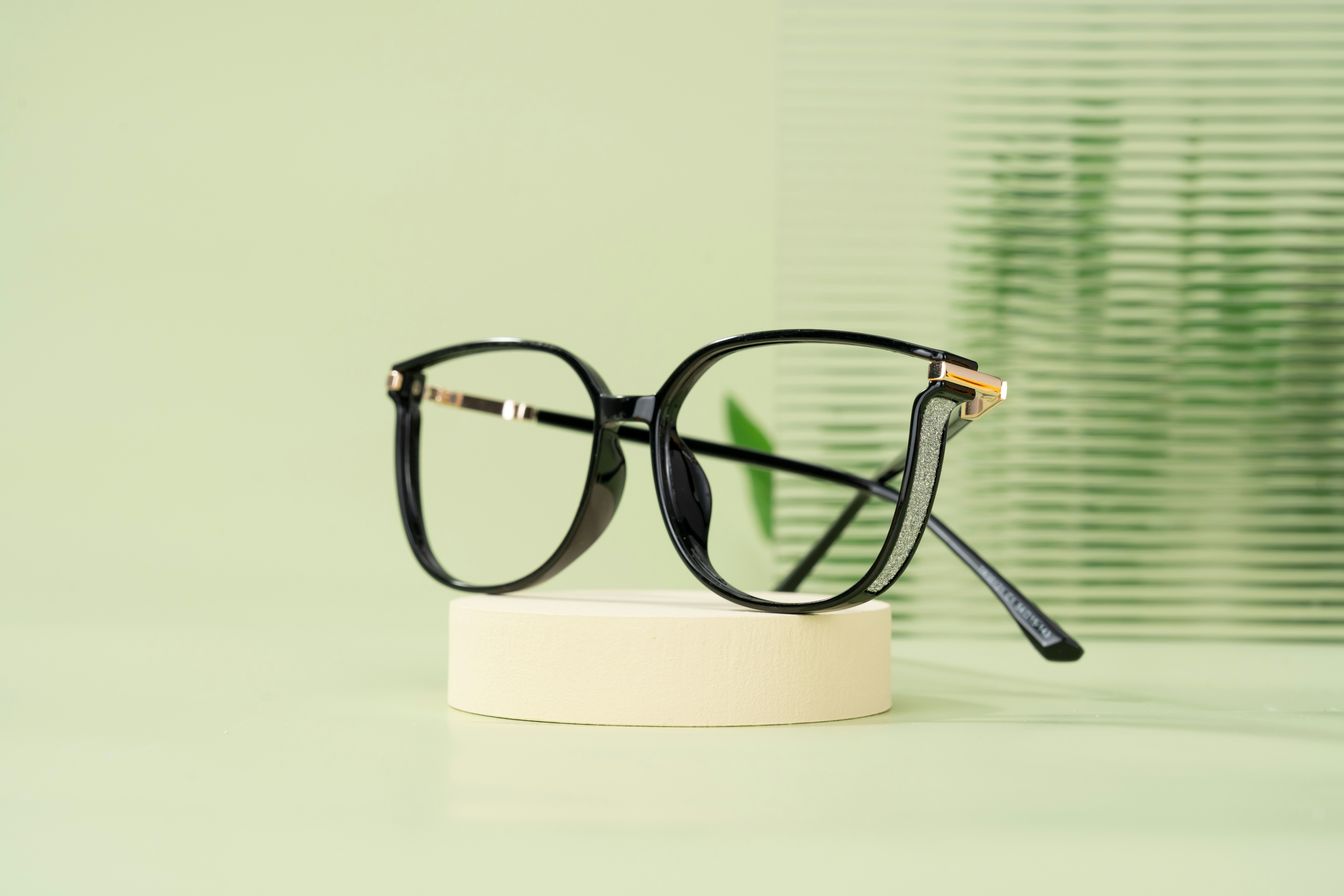 A pair of glasses sitting on top of a table