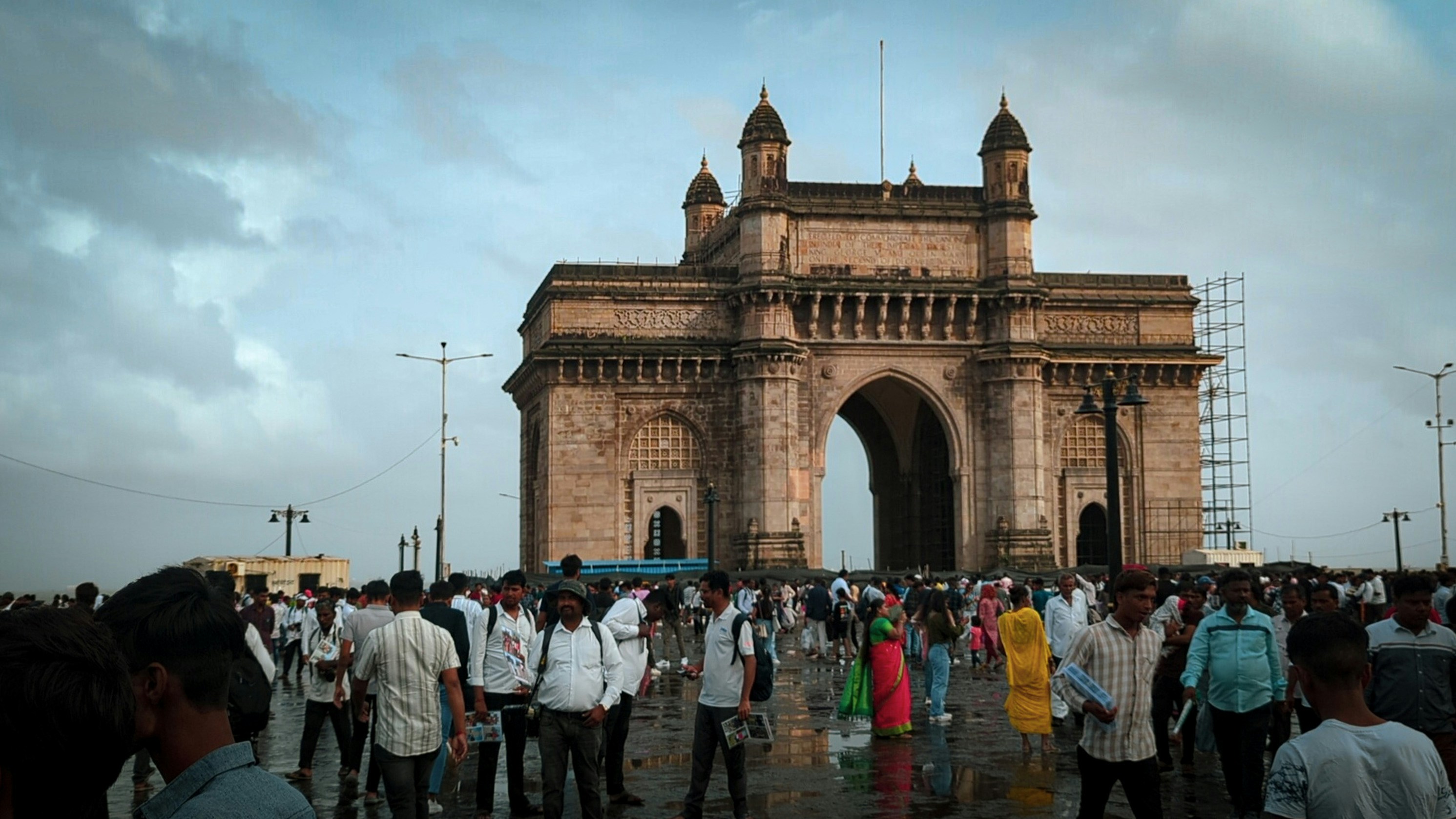 A group of people standing in front of a large building
