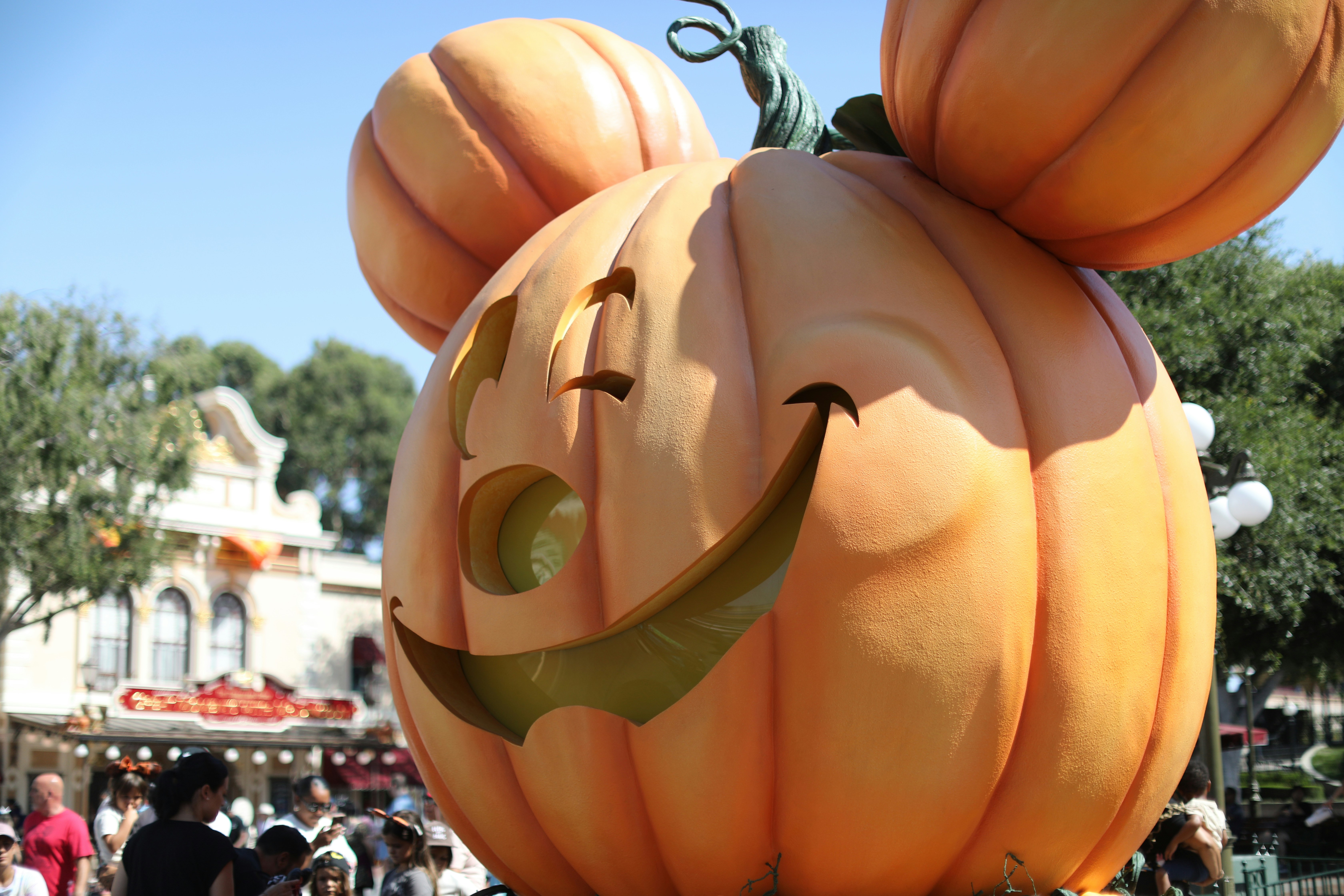 A large pumpkin shaped like a mickey mouse