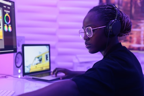 A woman sitting at a desk in front of a computer