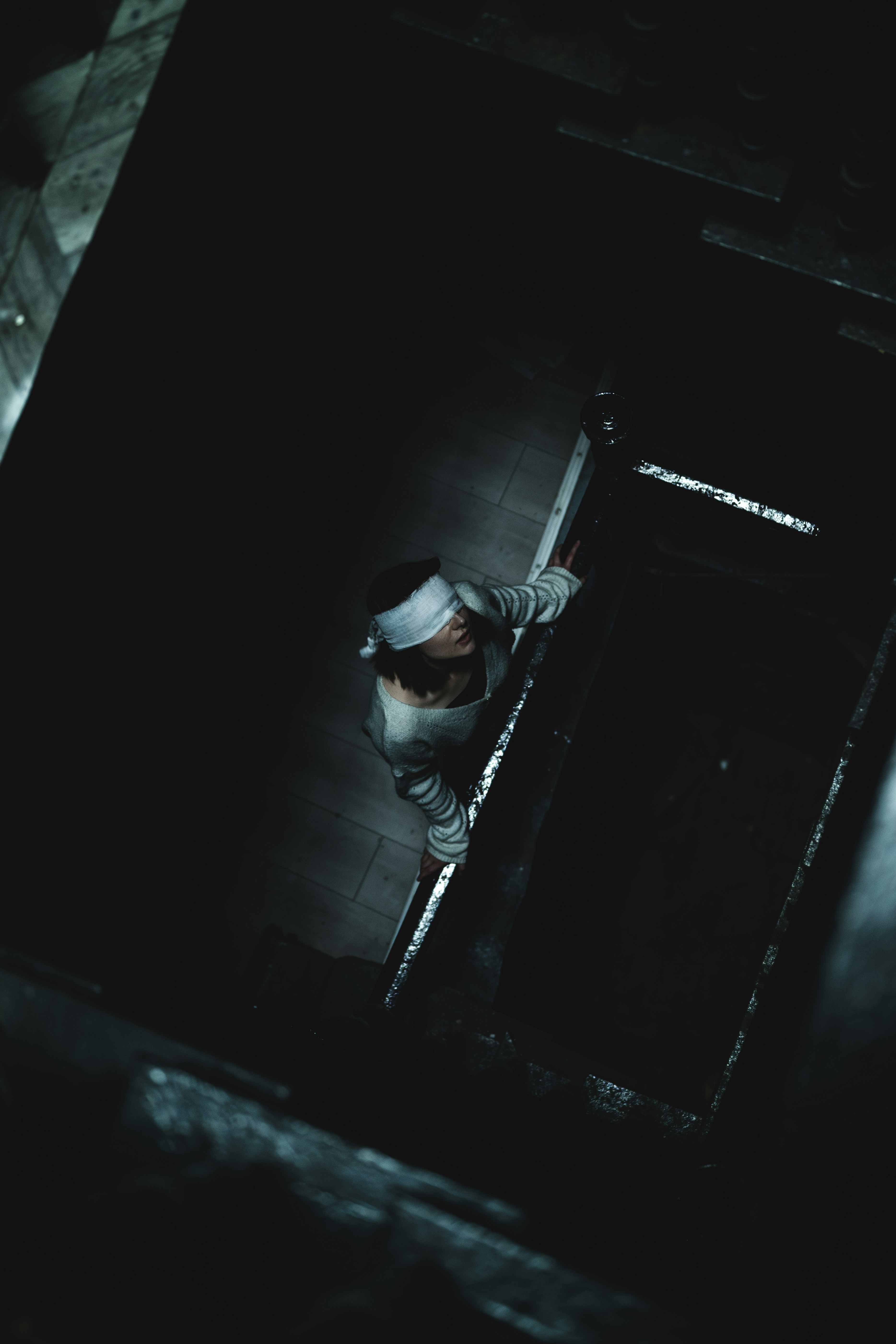 A man standing in a doorway in the dark