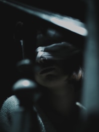 A blurry photo of a person holding a knife