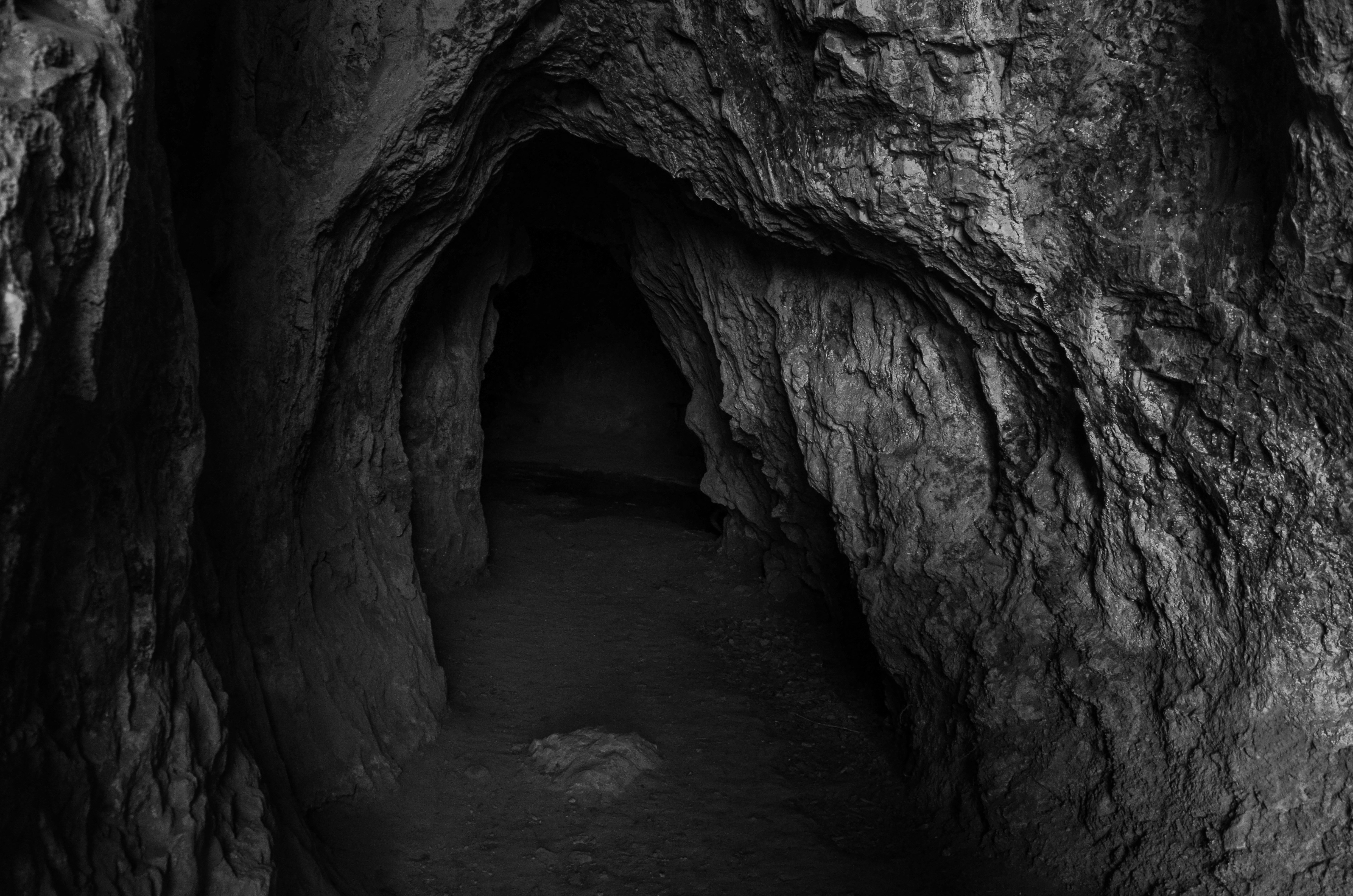 A black and white photo of a cave