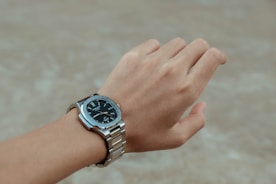 A person with a watch on their wrist