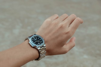 A person with a watch on their wrist