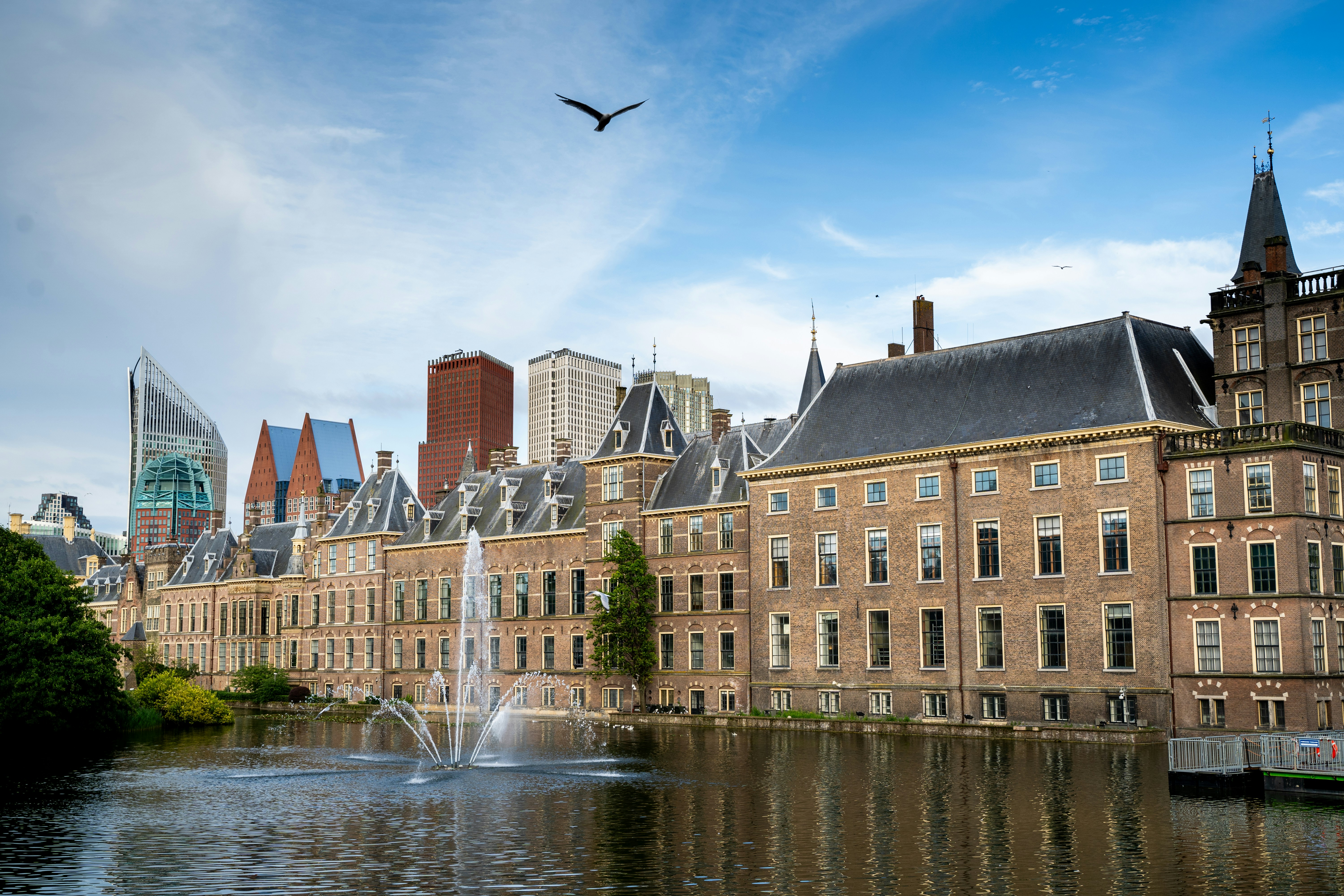 A large building with a fountain in front of it