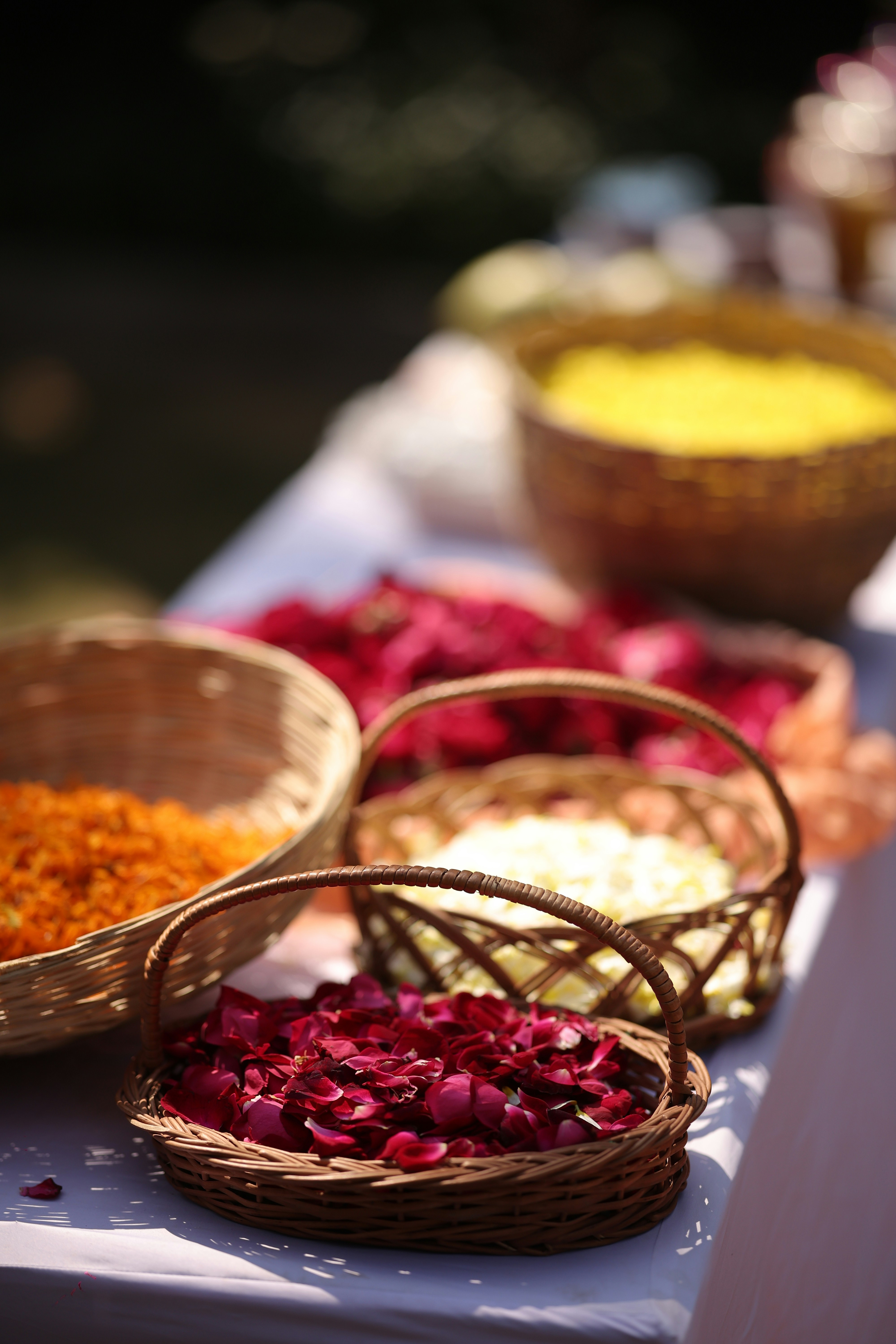 A table topped with baskets filled with different types of food