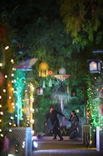 A couple of people that are standing in the street