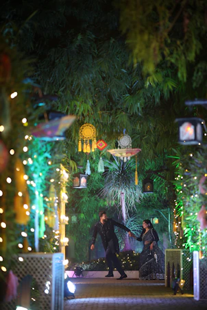 A couple of people that are standing in the street