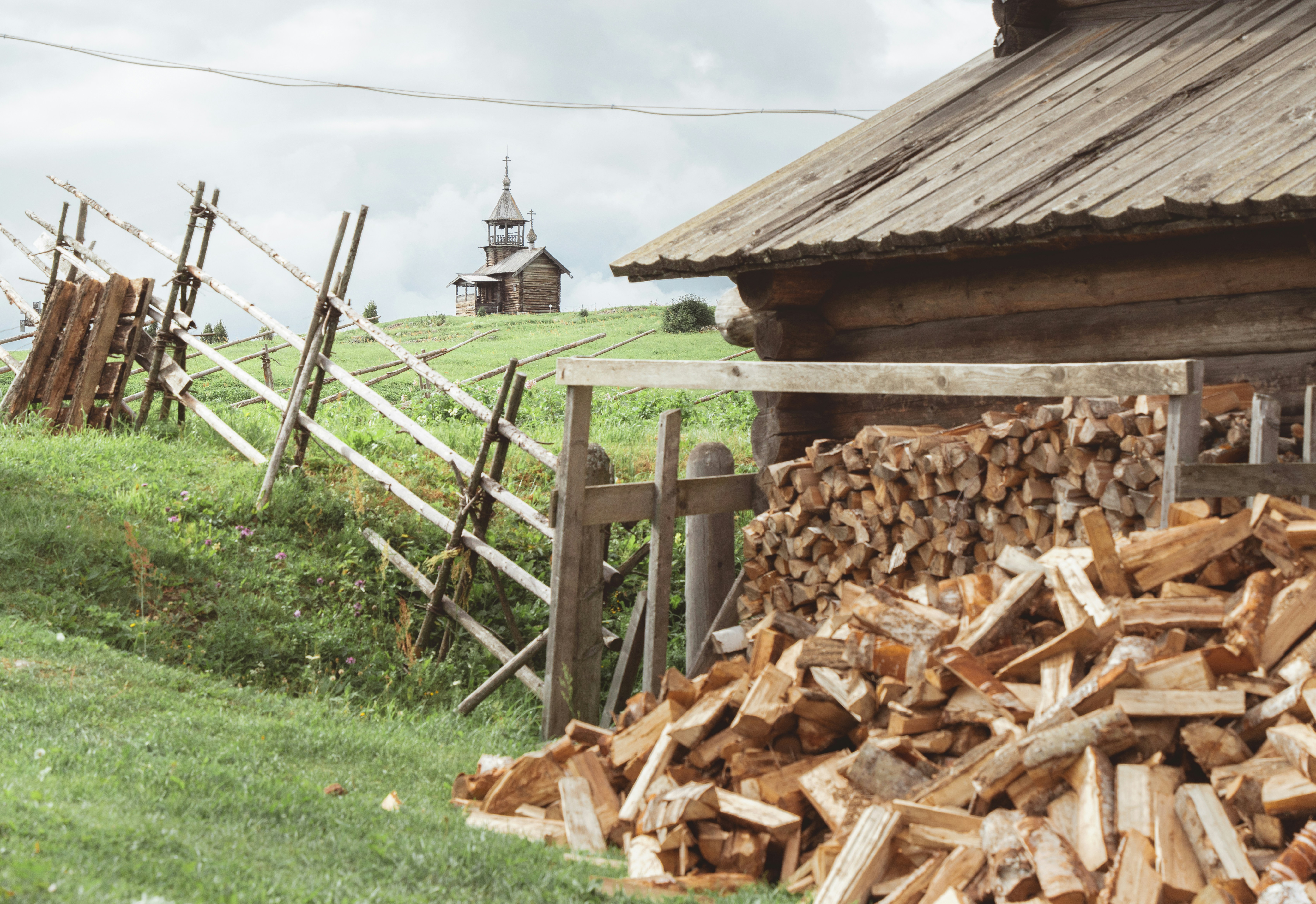 A pile of wood sitting in front of a building