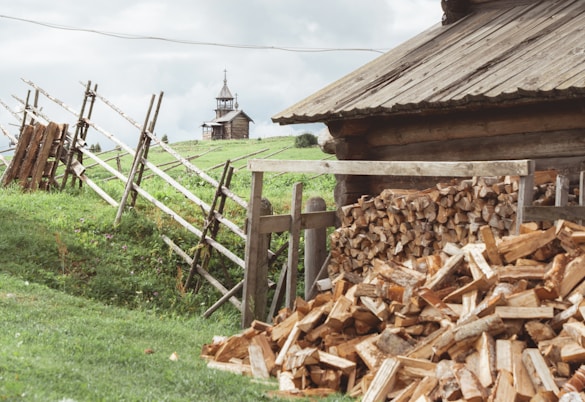 A pile of wood sitting in front of a building