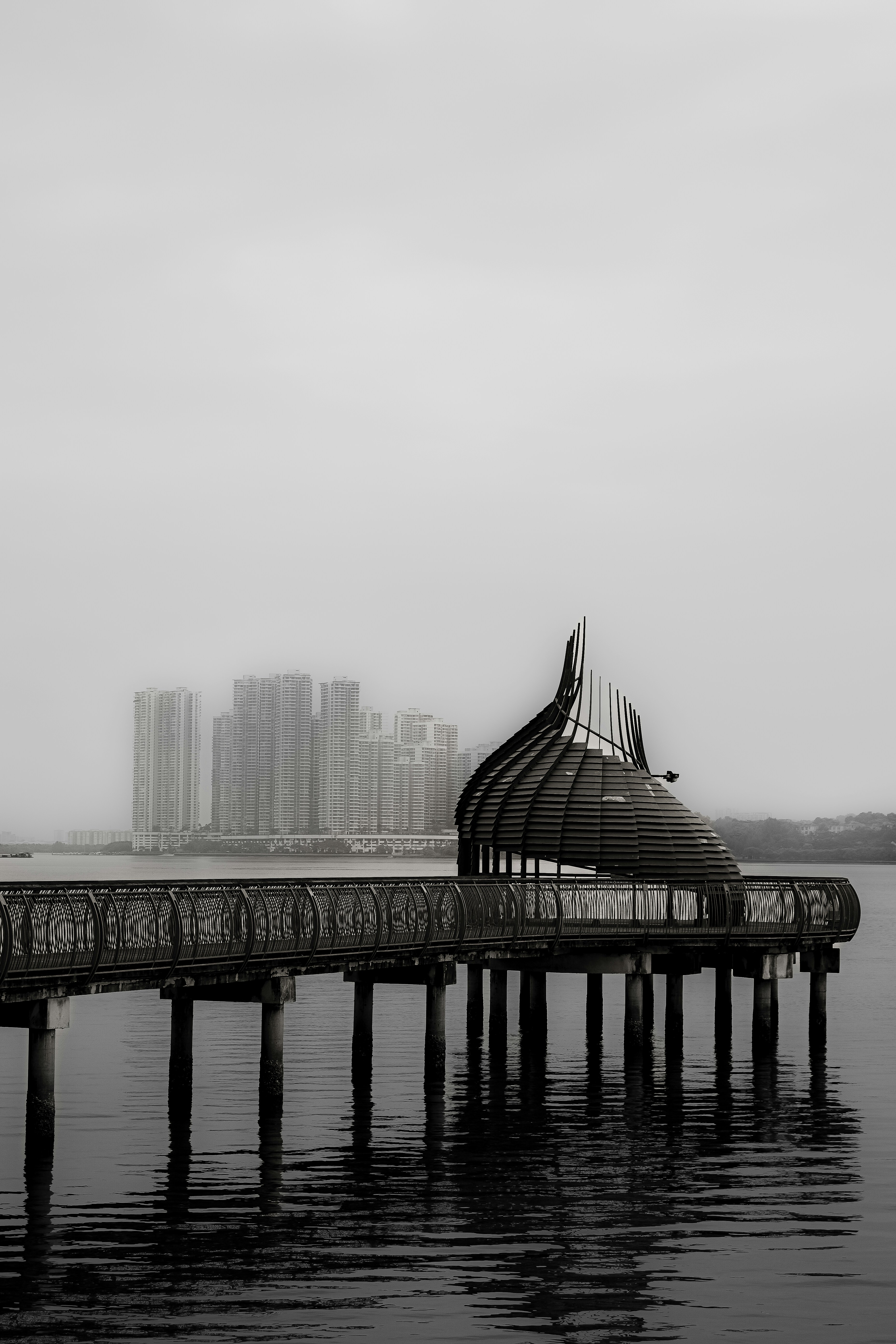 A pier with a building in the background