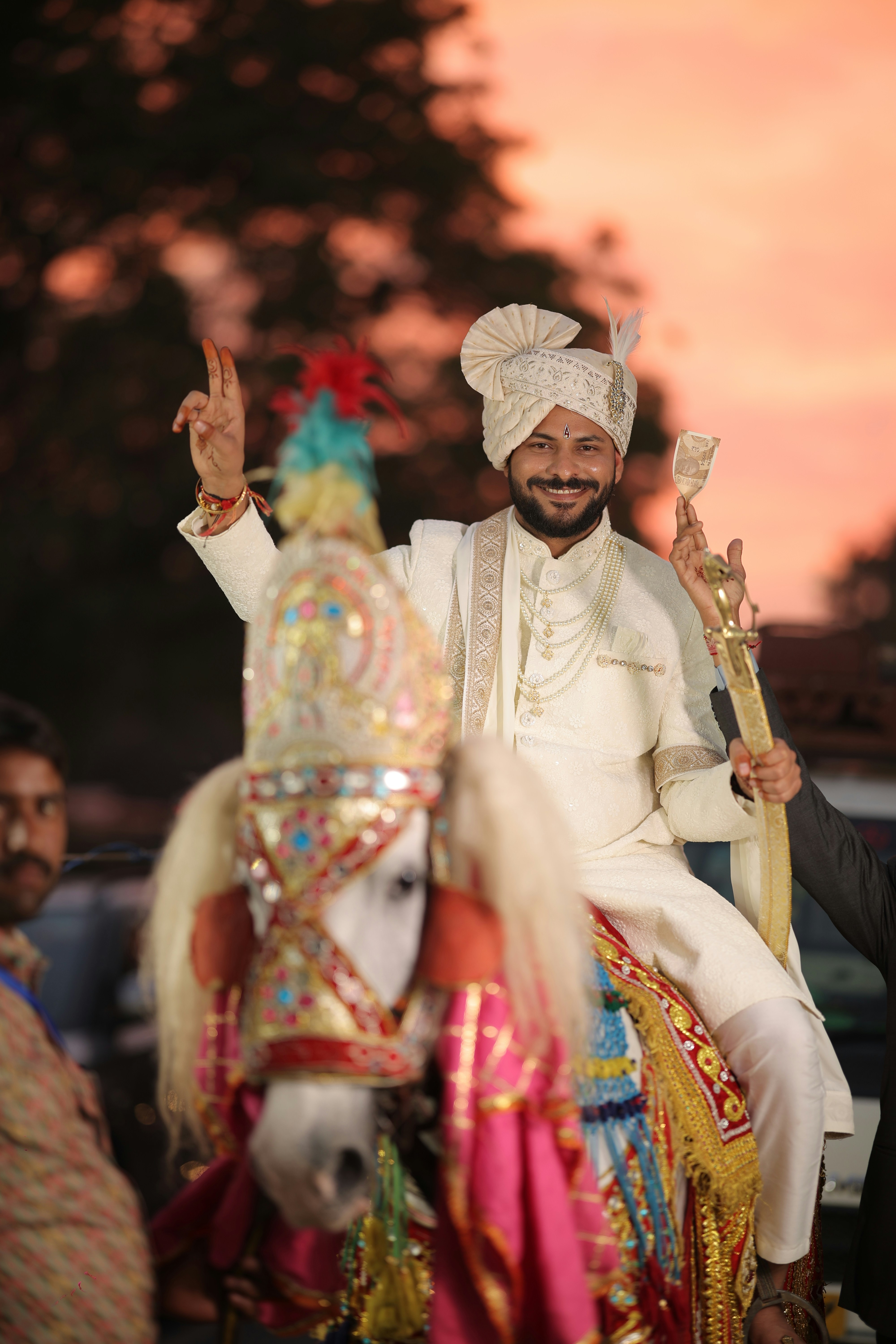 A man riding on the back of a white horse photo – Free Bridegroom Image ...
