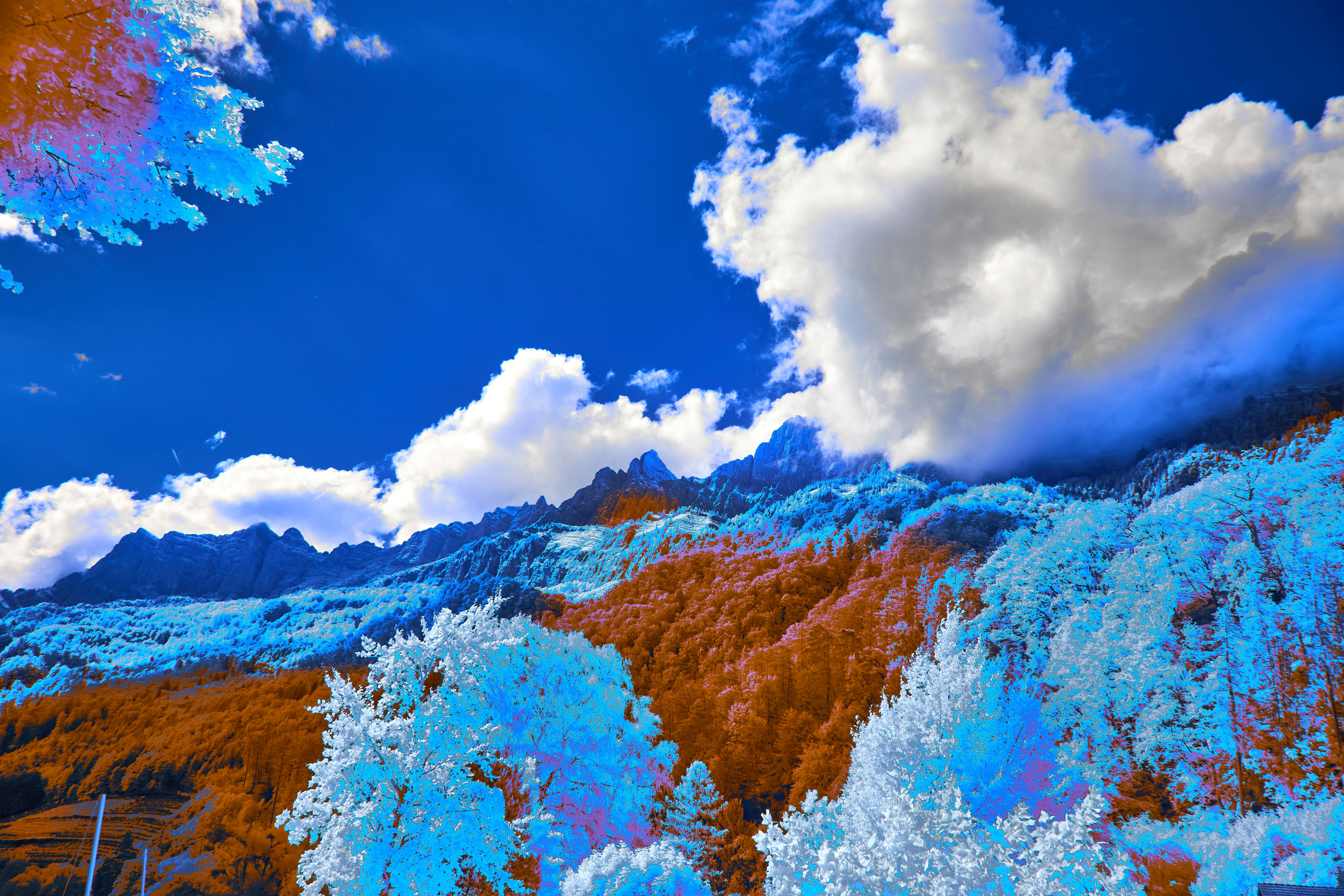 Surreal colorful landscape with mountains and vibrant sky