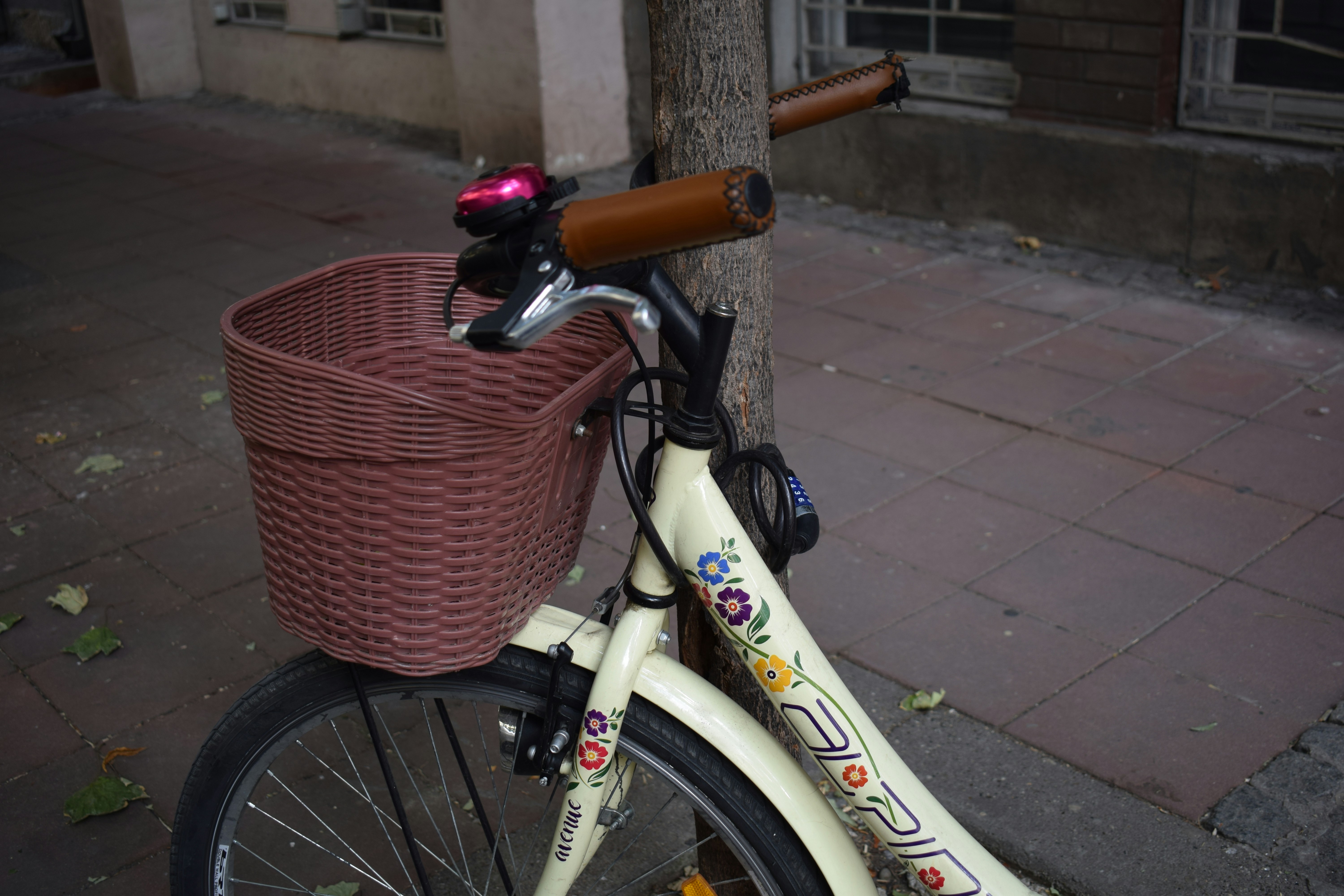 A bicycle with a basket on the front of it, 