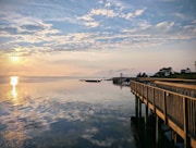A wooden pier stretching out into the ocean