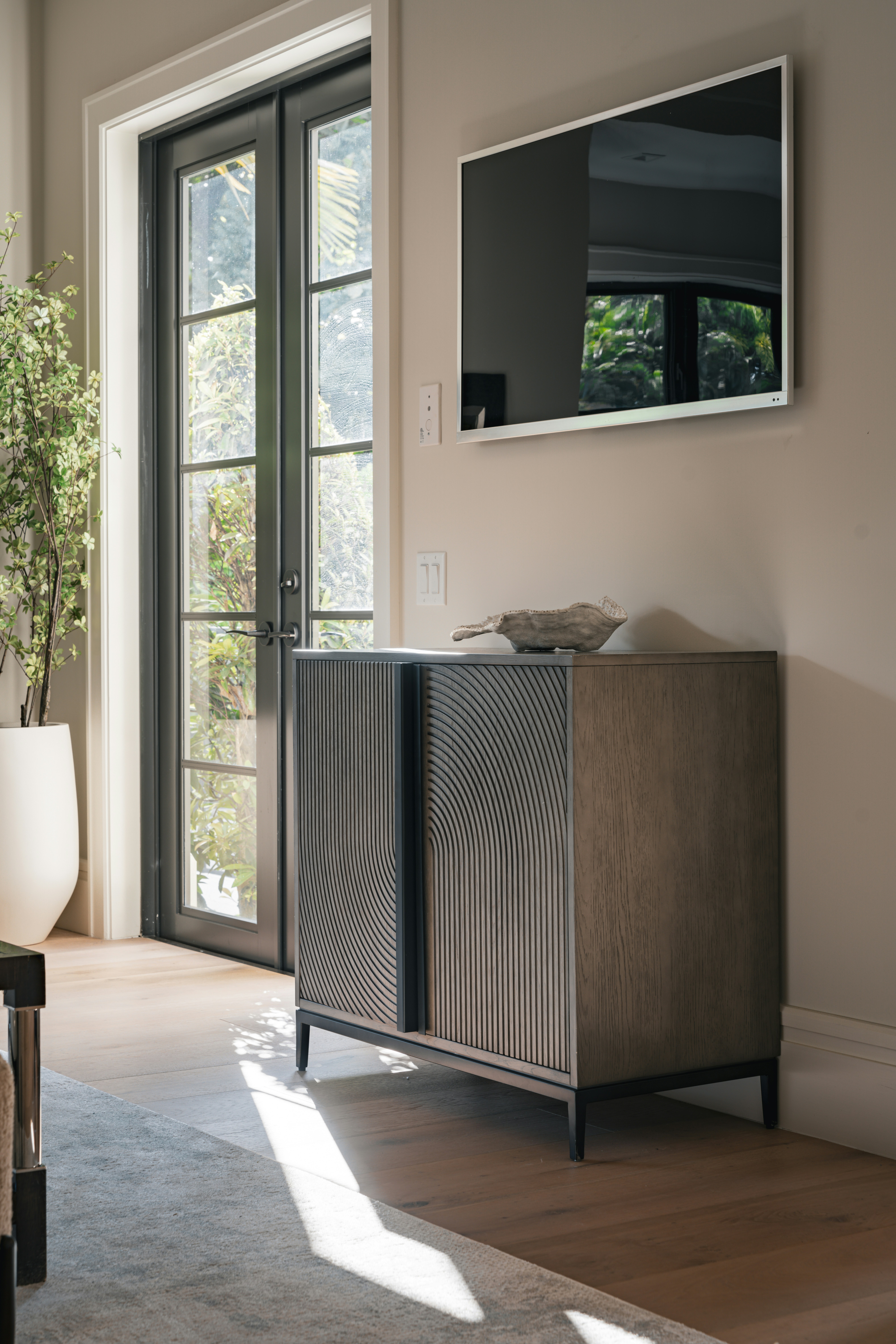 A living room filled with furniture and a flat screen TV