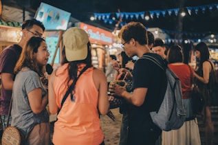 A group of people standing around each other