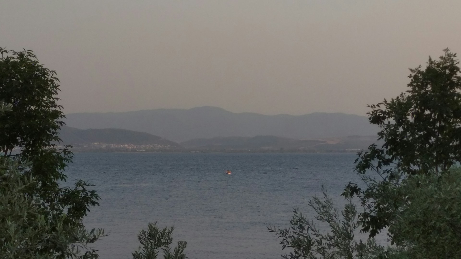 A plane flying over a body of water