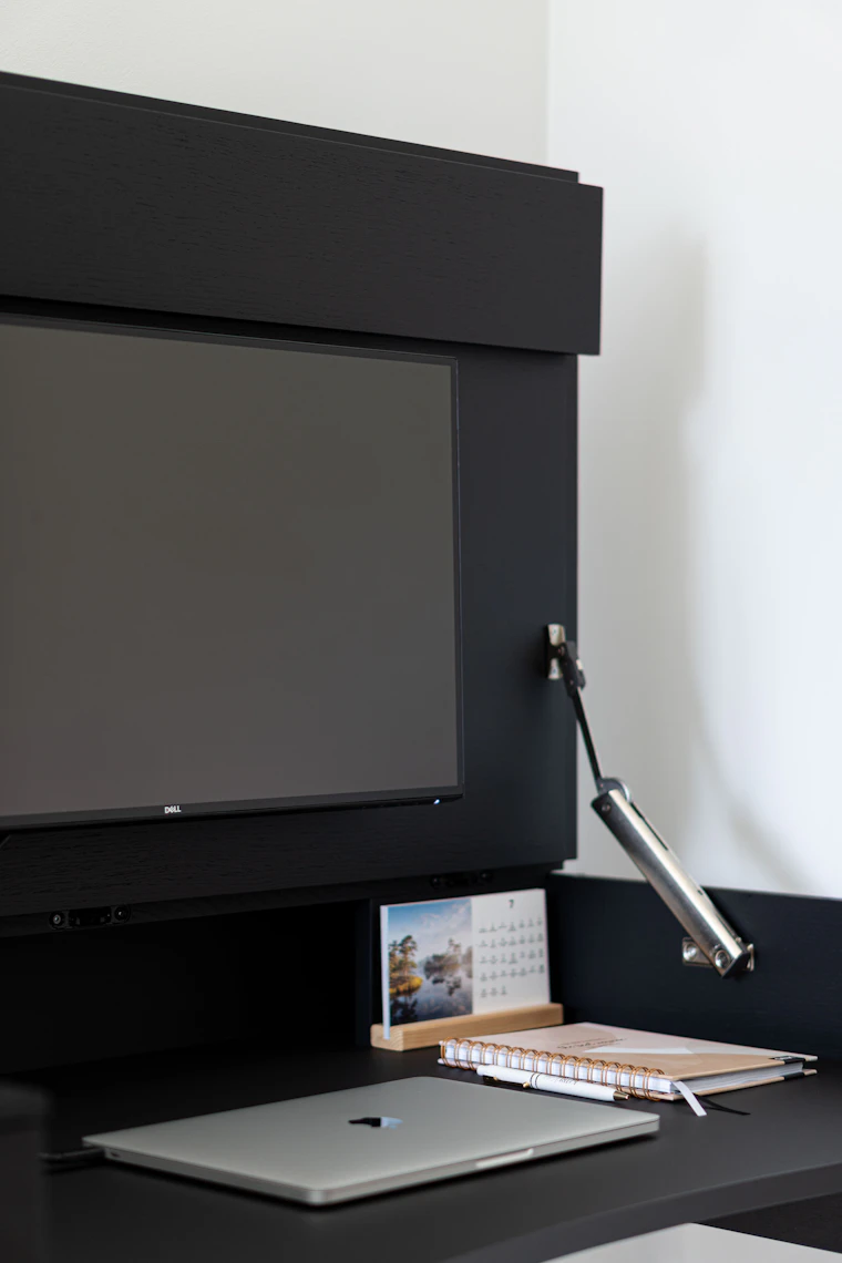 Home office addition with a clean desk wall