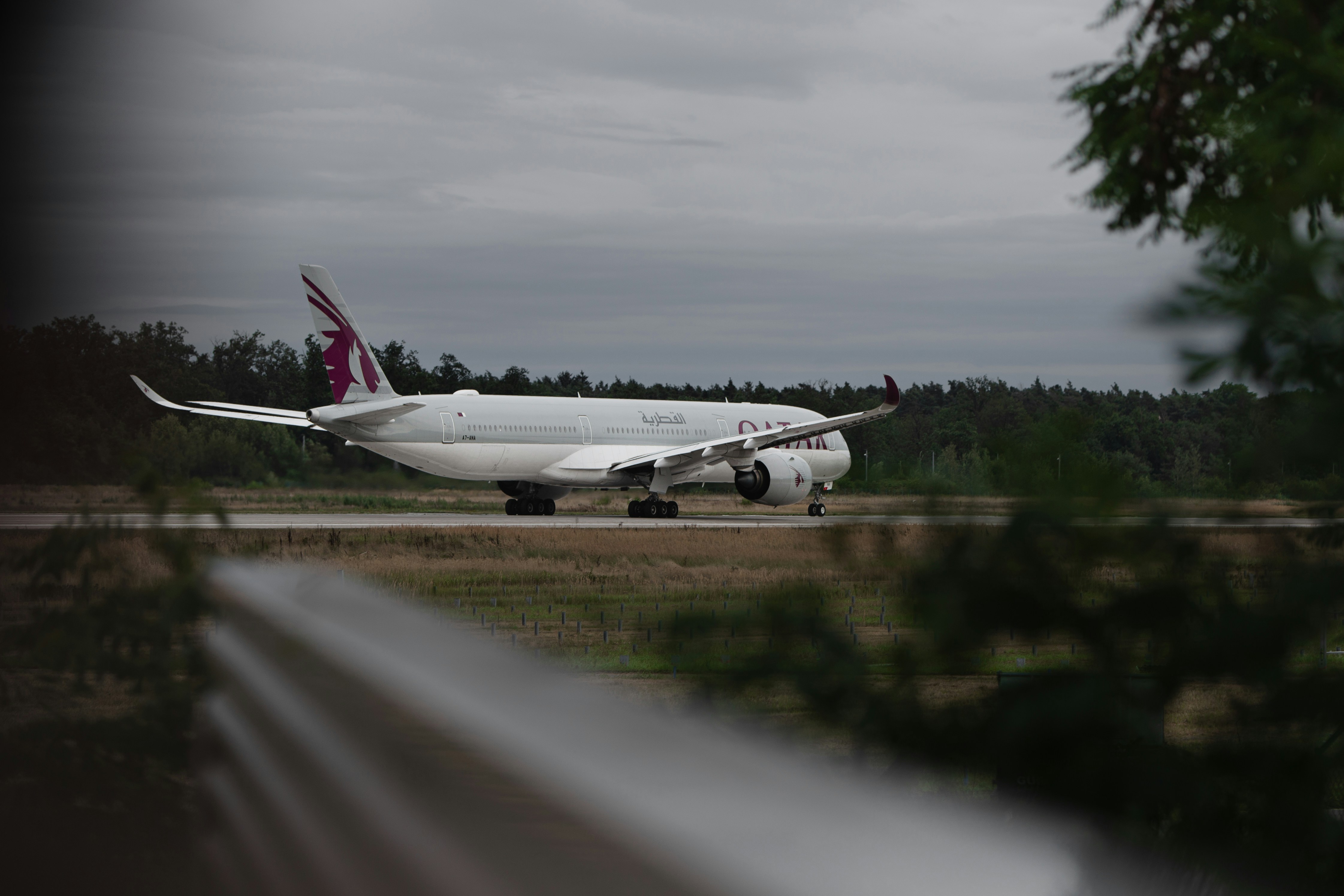 A large jetliner sitting on top of an airport runway