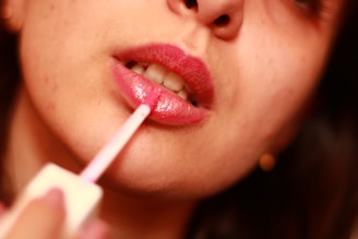 A close up of a woman brushing her teeth