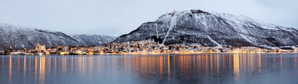 A lake with a mountain in the background
