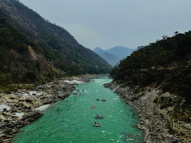 A group of people are rafting down a river