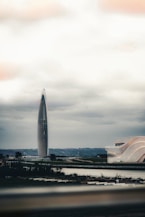 A large building with a very tall tower in the background