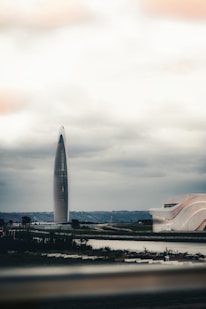 A large building with a very tall tower in the background