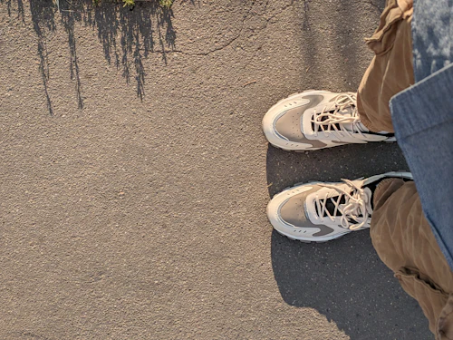 Trainers on a concrete pavement