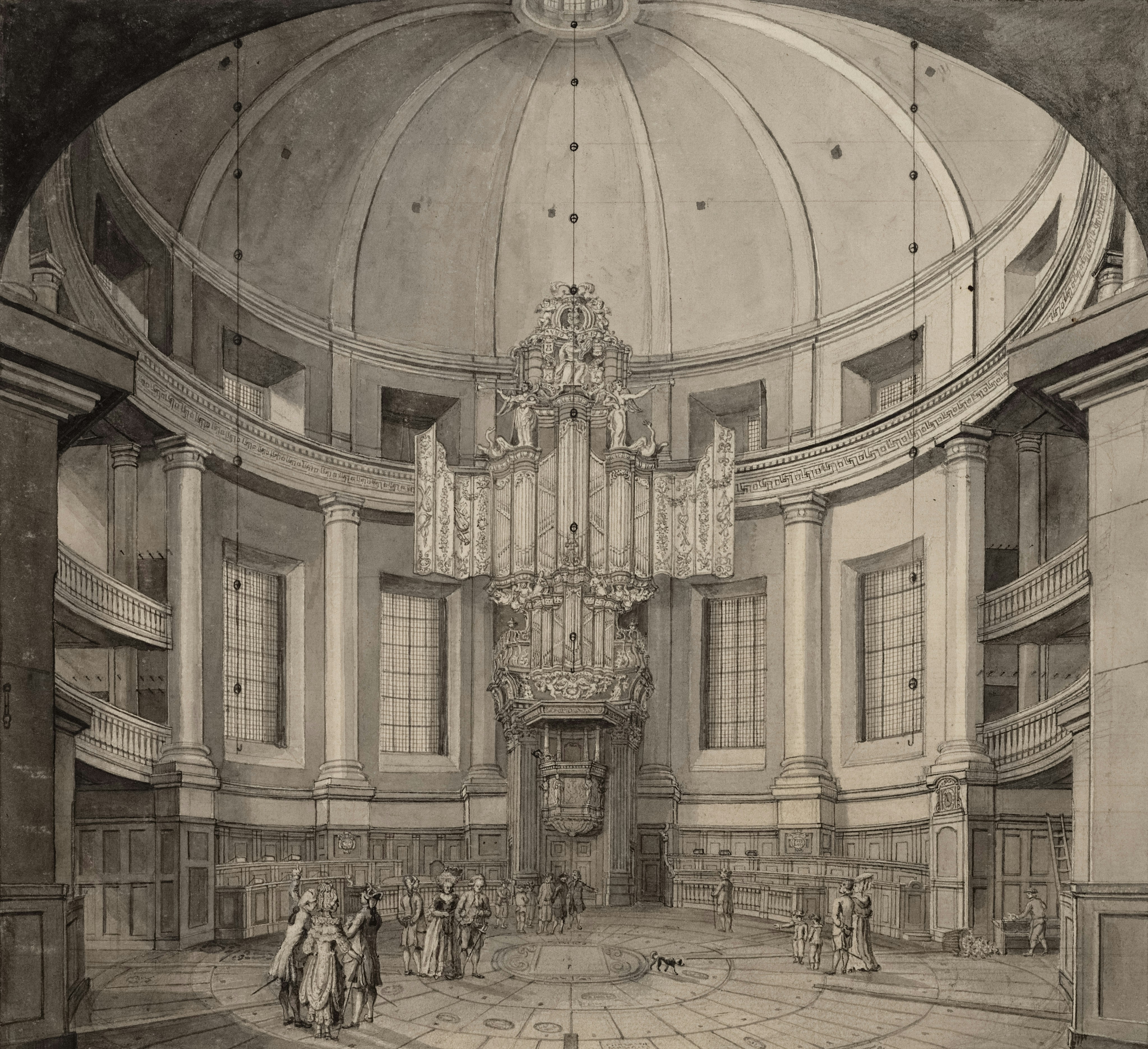 Interior view of a grand domed hall with an organ.