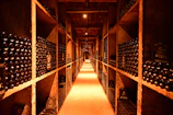 A long narrow room filled with lots of bottles