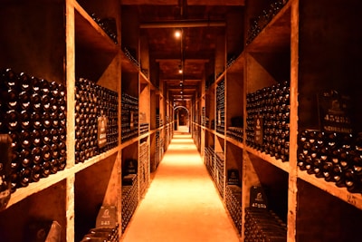 A long narrow room filled with lots of bottles