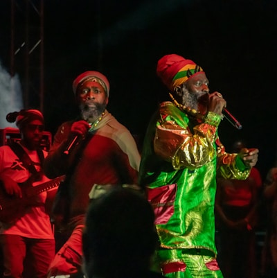 A group of men singing on top of a stage